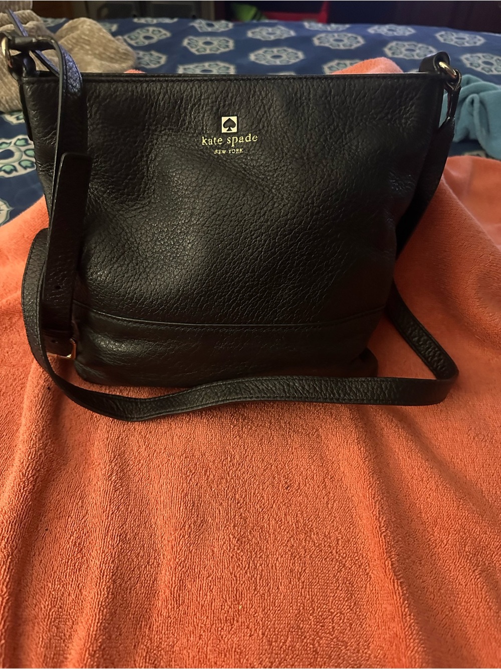 kate spade black pebbled leather crossbody with gold logo